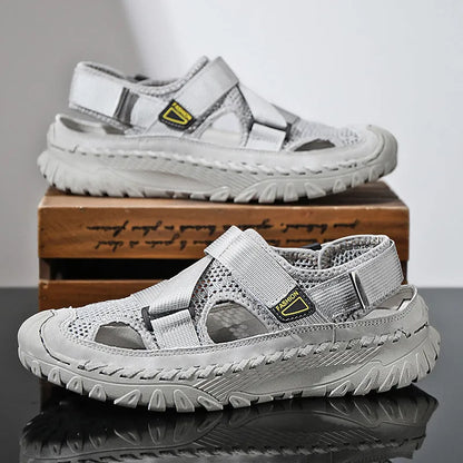 Men's grey casual sandals with hollow mesh upper, elastic band, and rubber sole.