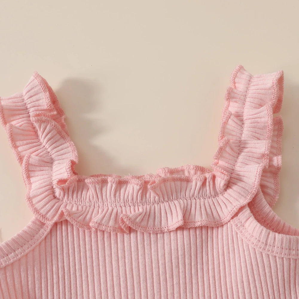 Girls' pink cotton romper and shorts two-piece set with included hair accessory