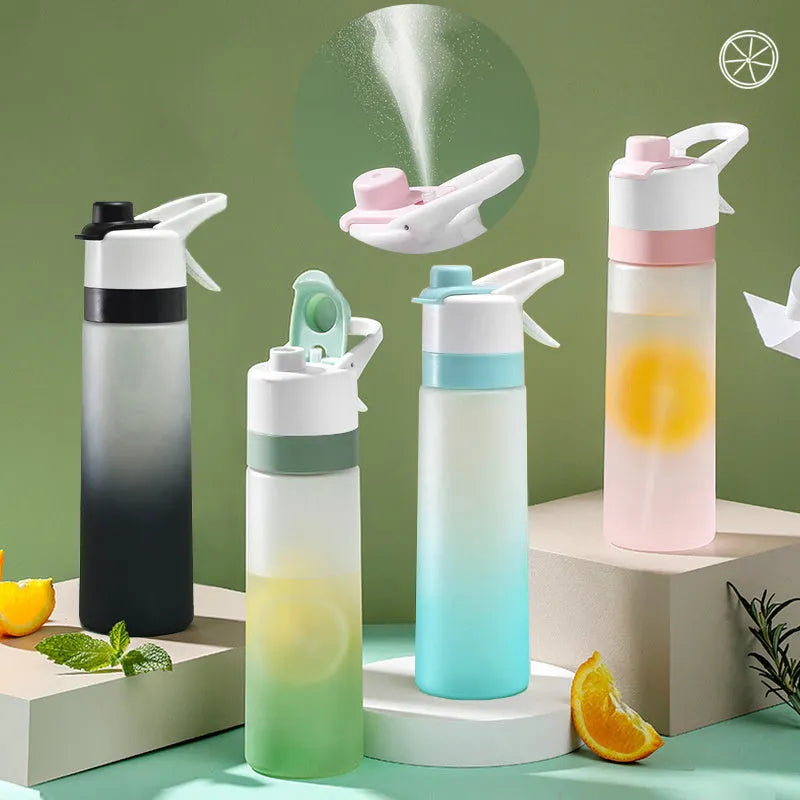 Large plastic spray water bottle with handle strap and leakproof lid in green colour.