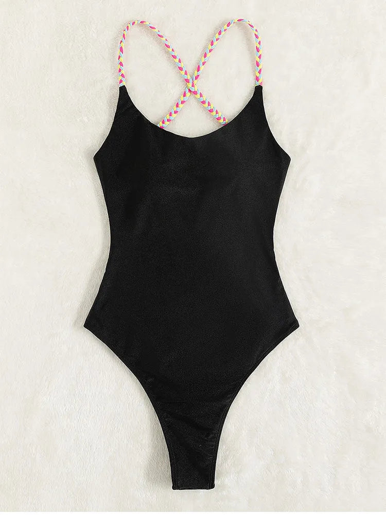 Black women's one-piece backless nylon swimsuit on a hanger