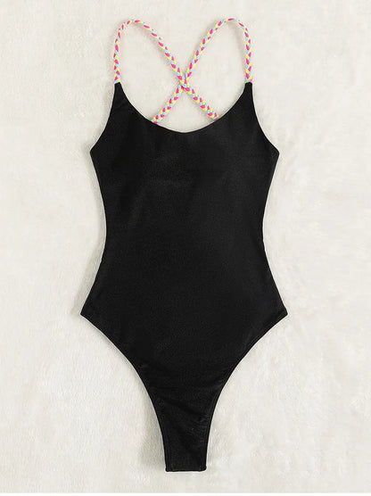 Black women's one-piece backless nylon swimsuit on a hanger
