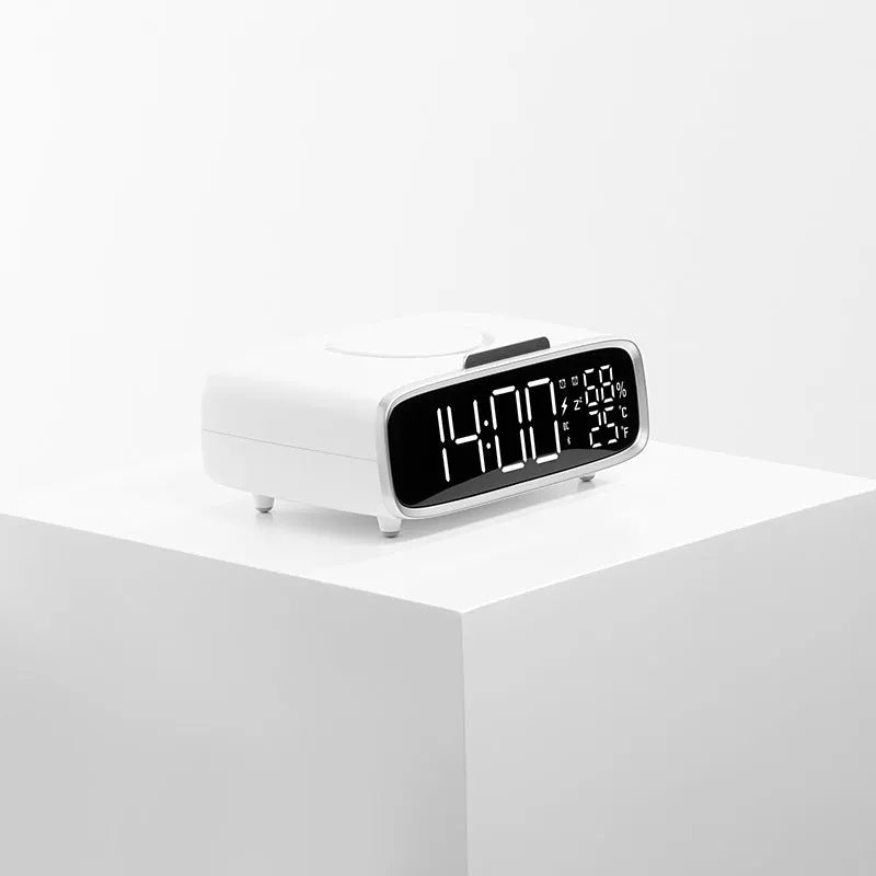 White Bluetooth speaker wireless charger with night lamp functions on wooden surface