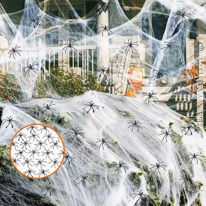 White cotton spider web Halloween decoration with multiple spiders draped over furniture for spooky atmospheric display