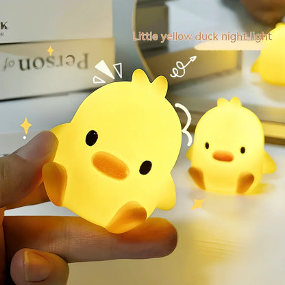 Small yellow duck-shaped night lamp measuring 6cm tall with warm LED light