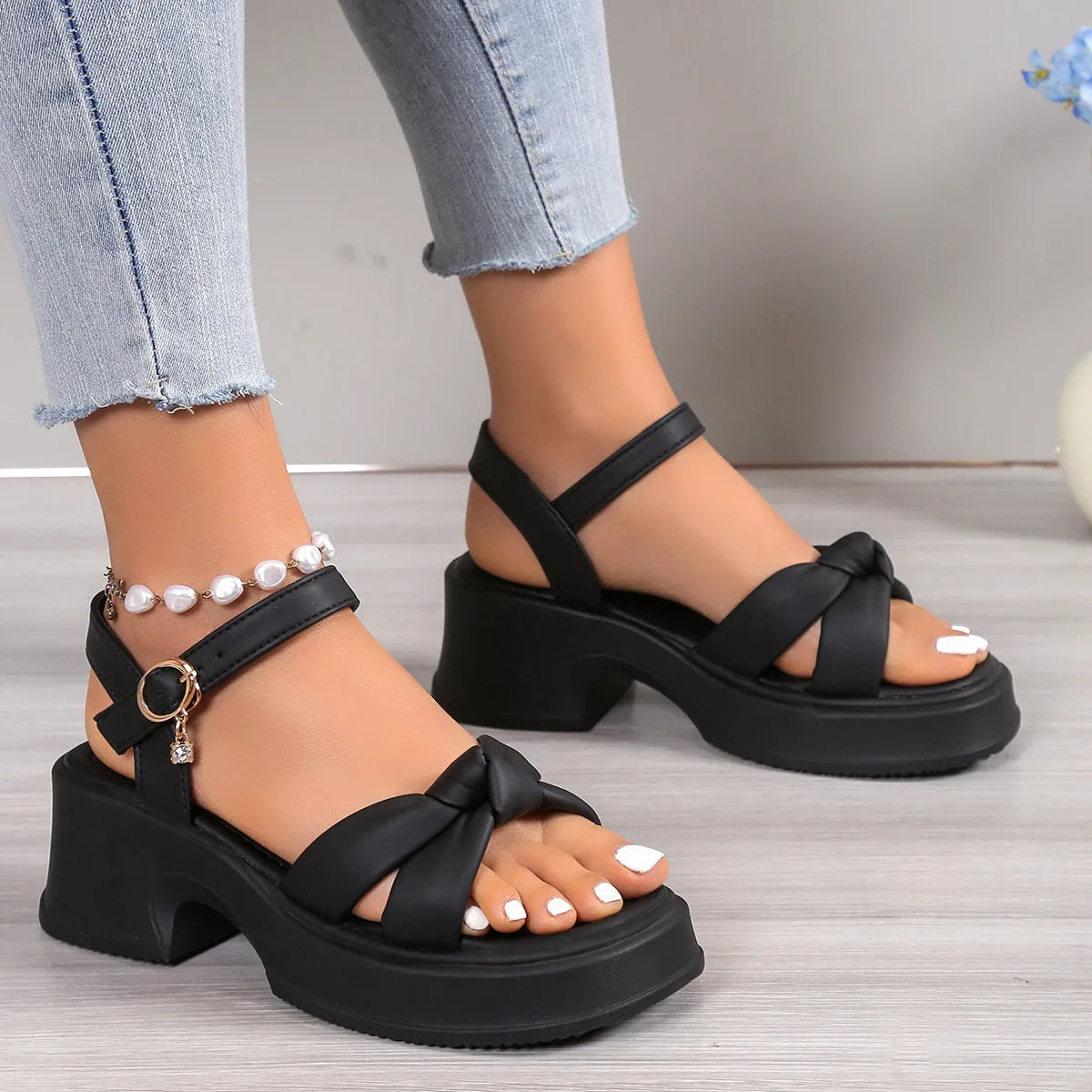 Black thick heel slippers with skirt design detail and button fastening