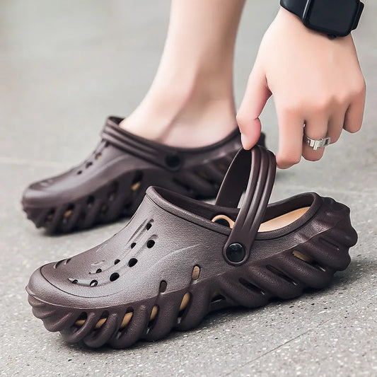 Men's beige slipper sandals with hollow-out design and textured non-slip sole, side view.