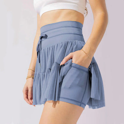 Stylish high-waist pleated mini skirt with lace-up design and built-in anti-exposure safety shorts, available in a variety of vibrant colors.