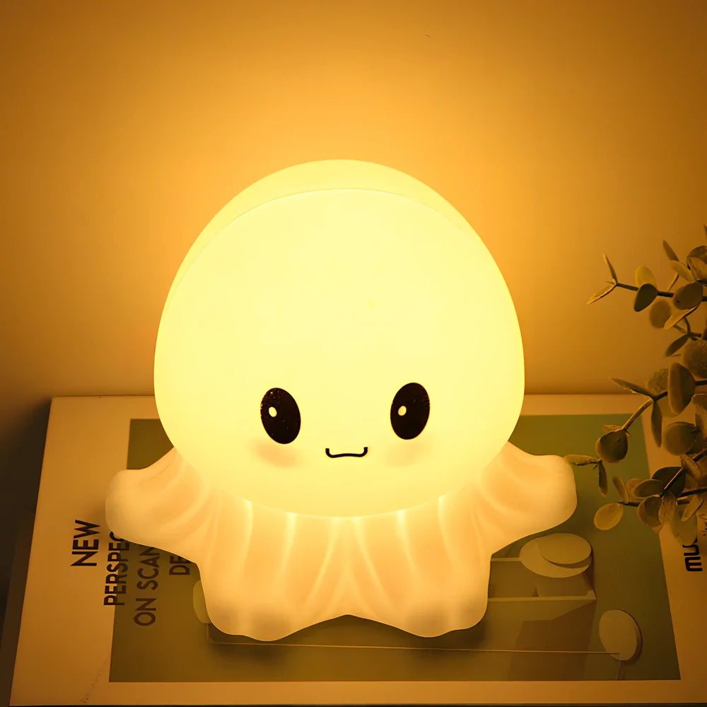 White jellyfish-shaped night light with octopus tentacle details and rechargeable lighting modes