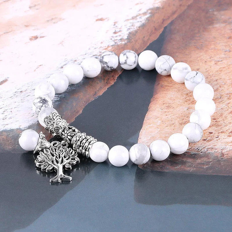 Elegant Vintage Frosted White Pine Bead Bracelet on a wooden background