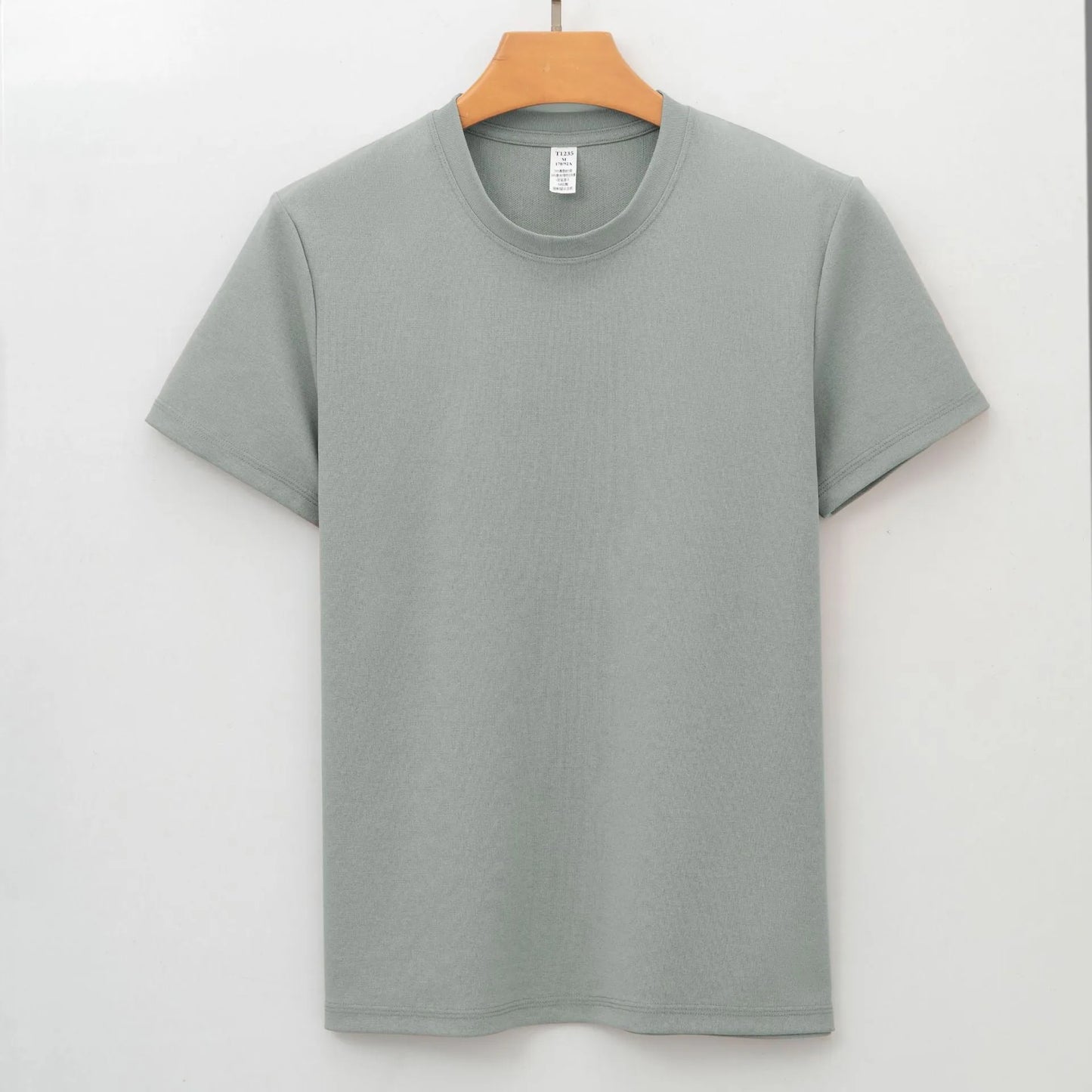 Men's solid colour antibacterial quick-dry short sleeve T-shirt on a hanger.