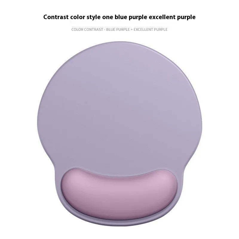 Silicone mouse mat with wristband in a gradient blue black colour pattern on a desk.