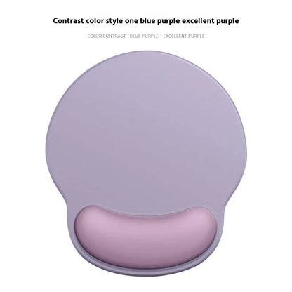 Silicone mouse mat with wristband in a gradient blue black colour pattern on a desk.