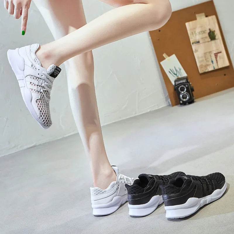 Low-top casual sneaker in mesh with hollow-out design and round toe.
