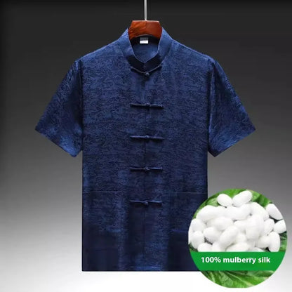 Traditional light green mulberry silk Tang suit for men on a hanger.