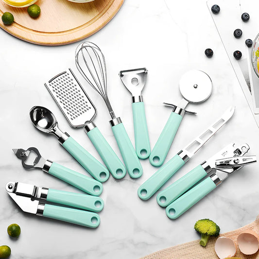 9-piece stainless steel kitchen utensils with black plastic handles arranged for food preparation