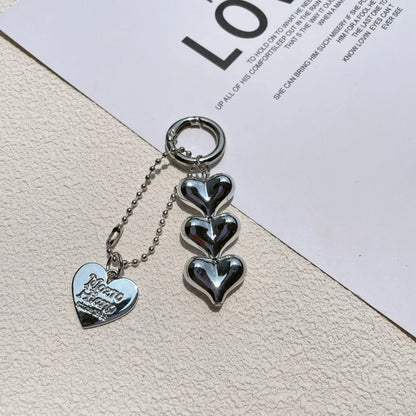 Acrylic key ring with an electroplated decorative charm in a choice of heart, bell, or water drop shapes.