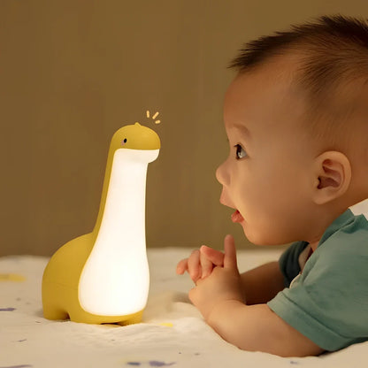 Dinosaur-shaped children's night light in lemon yellow with USB charging cable and 3000K warm white illumination