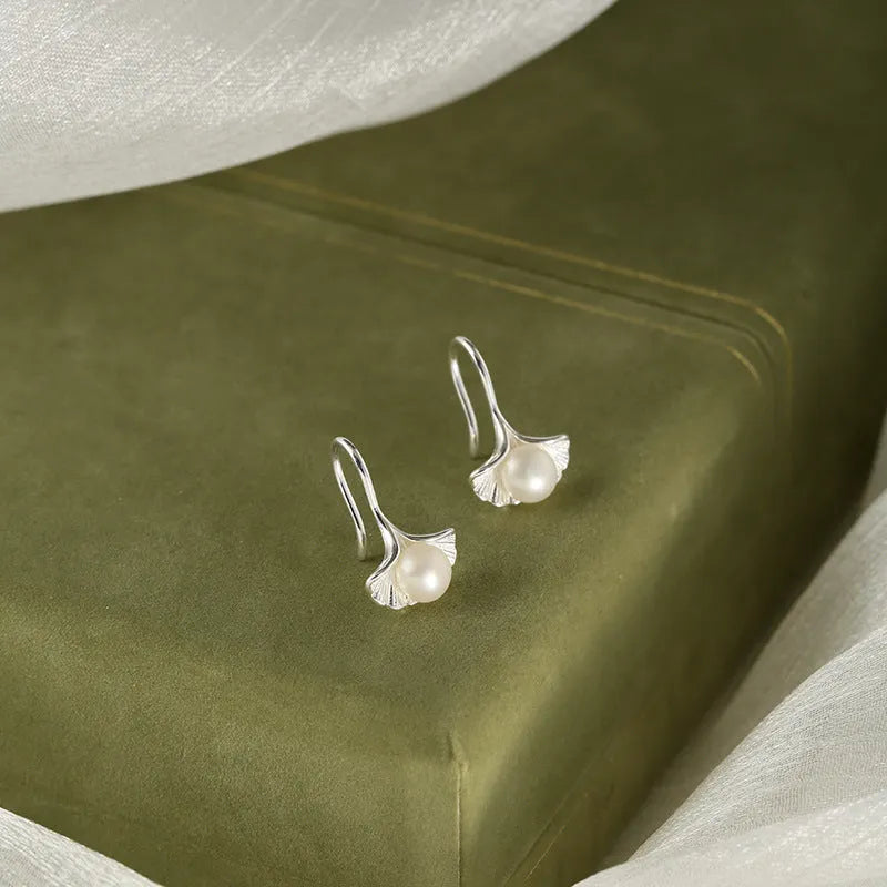 Silver ginkgo leaf ear hooks for women with pearl detail, copper electroplated flower-shaped earrings, one pair