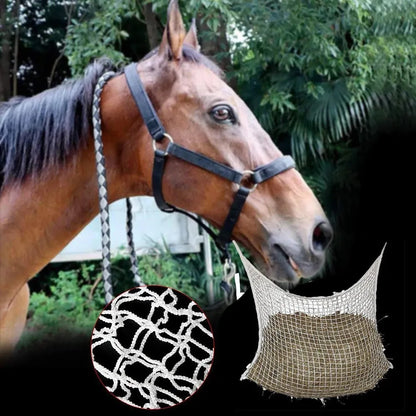 Black woven grid hanging feeding bag for horses, shown against a stable background.
