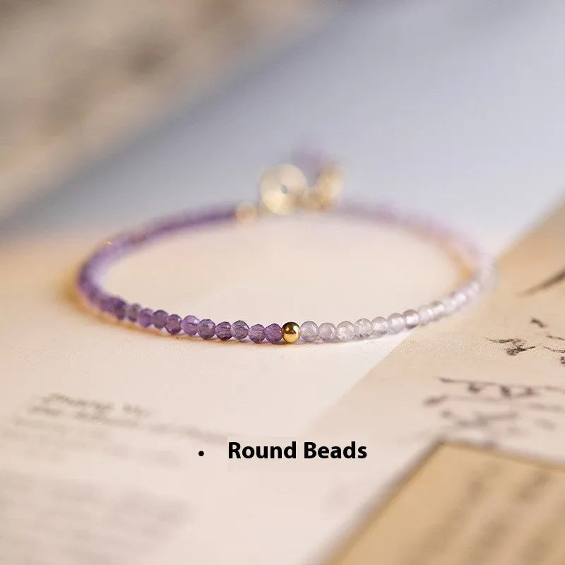 Purple geometric crystal bracelet threaded on 2mm purple rattan.