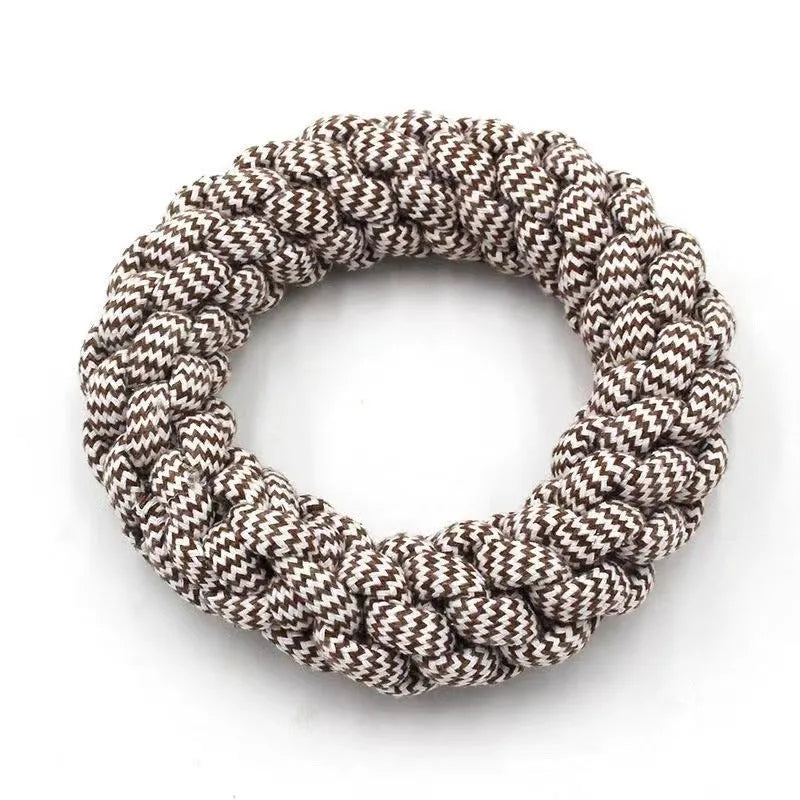 Cotton string braided ring knot dog chew toy showing woven texture and ring shape