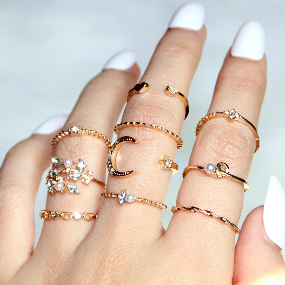 Enchanting gold-plated celestial-themed rings featuring stars, moons, and pearls