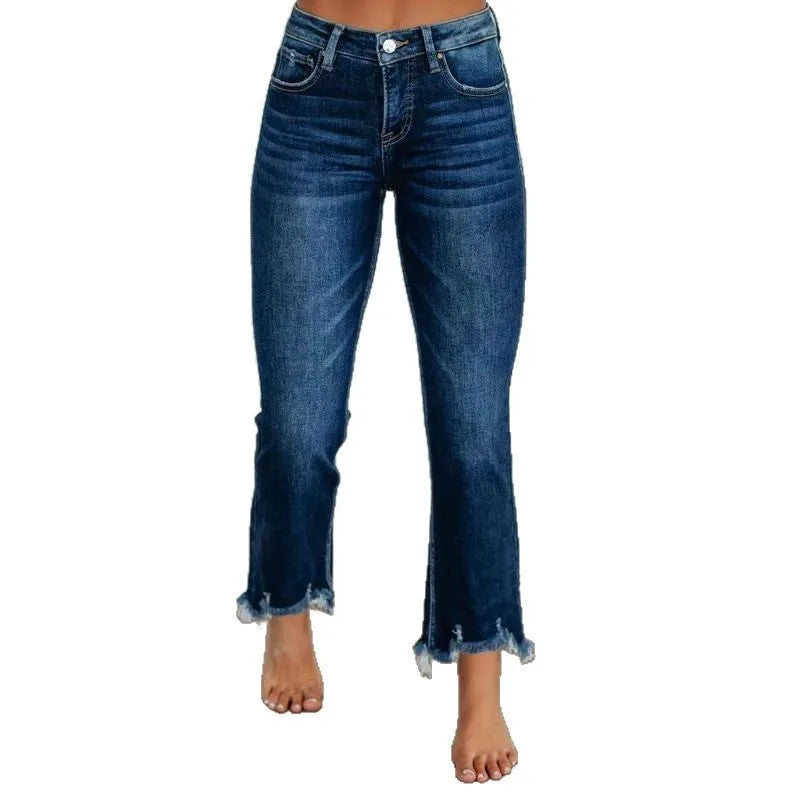 Women's solid colour denim trousers with hand-worn finish in dark blue, showing casual styling and 100% cotton construction