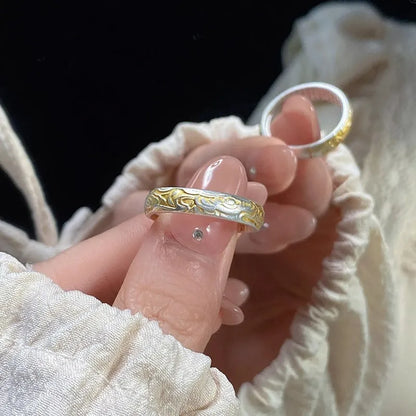 Open mouth silver and gold ring with J14 Xiangyun geometric pattern on a white copper band.