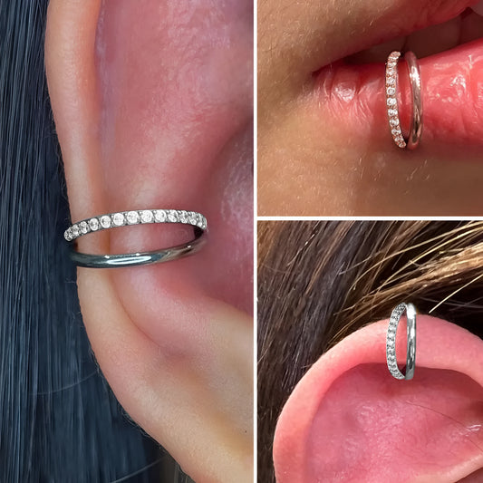 Pair of titanium alloy nose rings on a plain background showing silver, gold, black, and rose gold colour options.