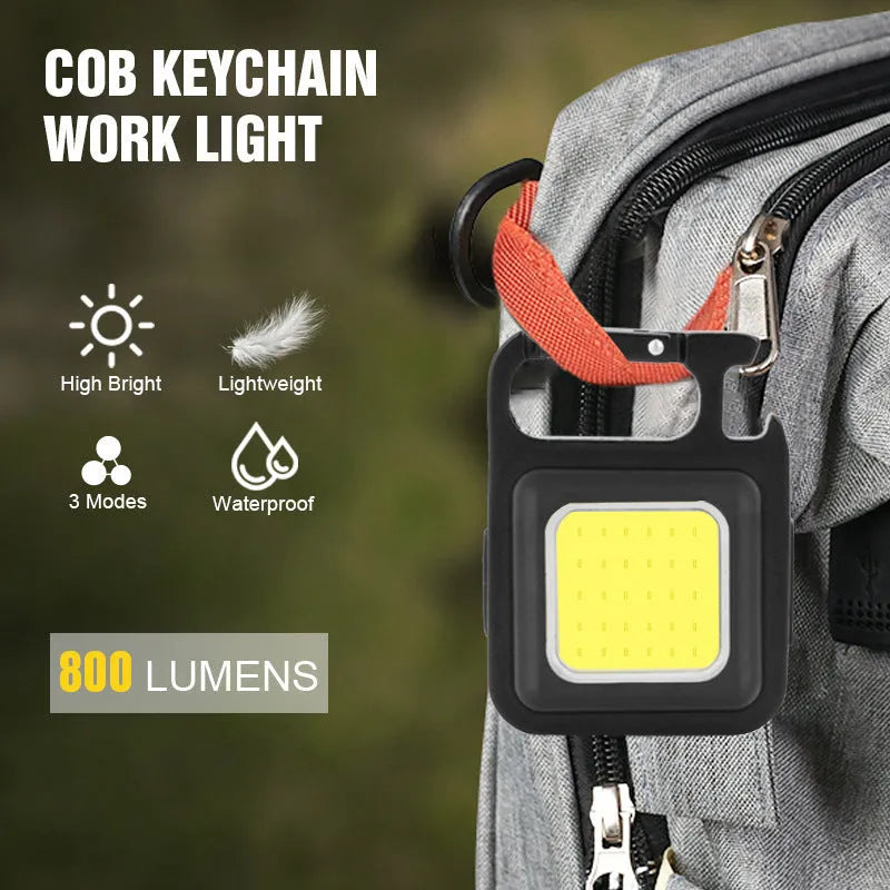 Black aluminium alloy USB rechargeable keychain light with magnetic base and foldable handle