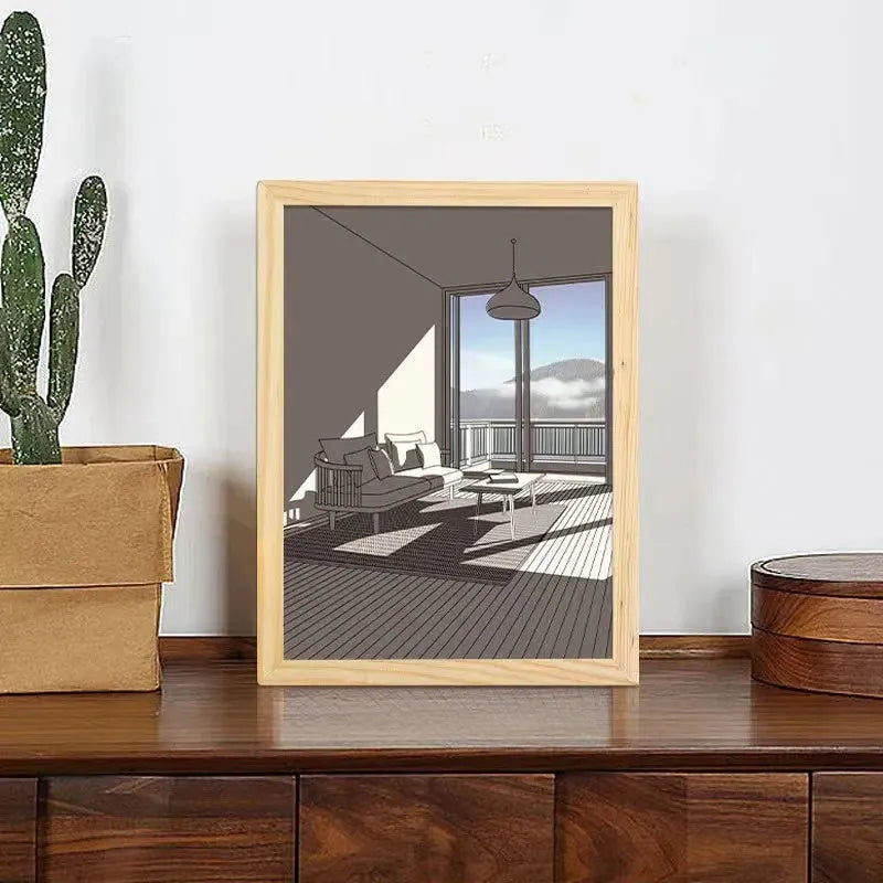 LED illuminated decorative picture light on a table showing a scenic landscape image glowing from within.