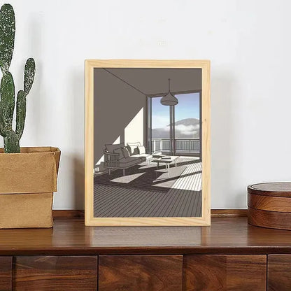 LED illuminated decorative picture light on a table showing a scenic landscape image glowing from within.