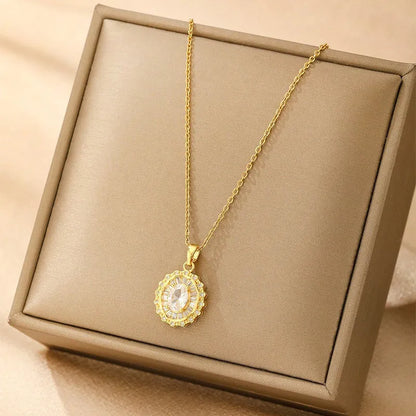 Women's gold electroplated copper necklace showing four pendant options: heart, butterfly, cross and round diamond