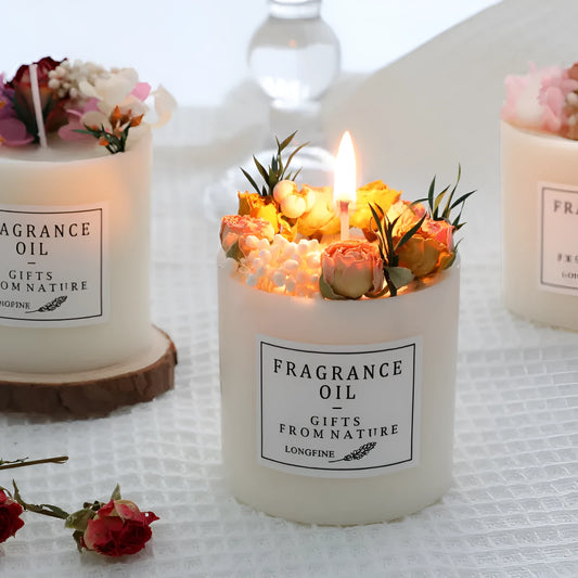 Aromatherapy candle with dried flowers on a wooden chip base, showing blue campanula and lavender scent options.