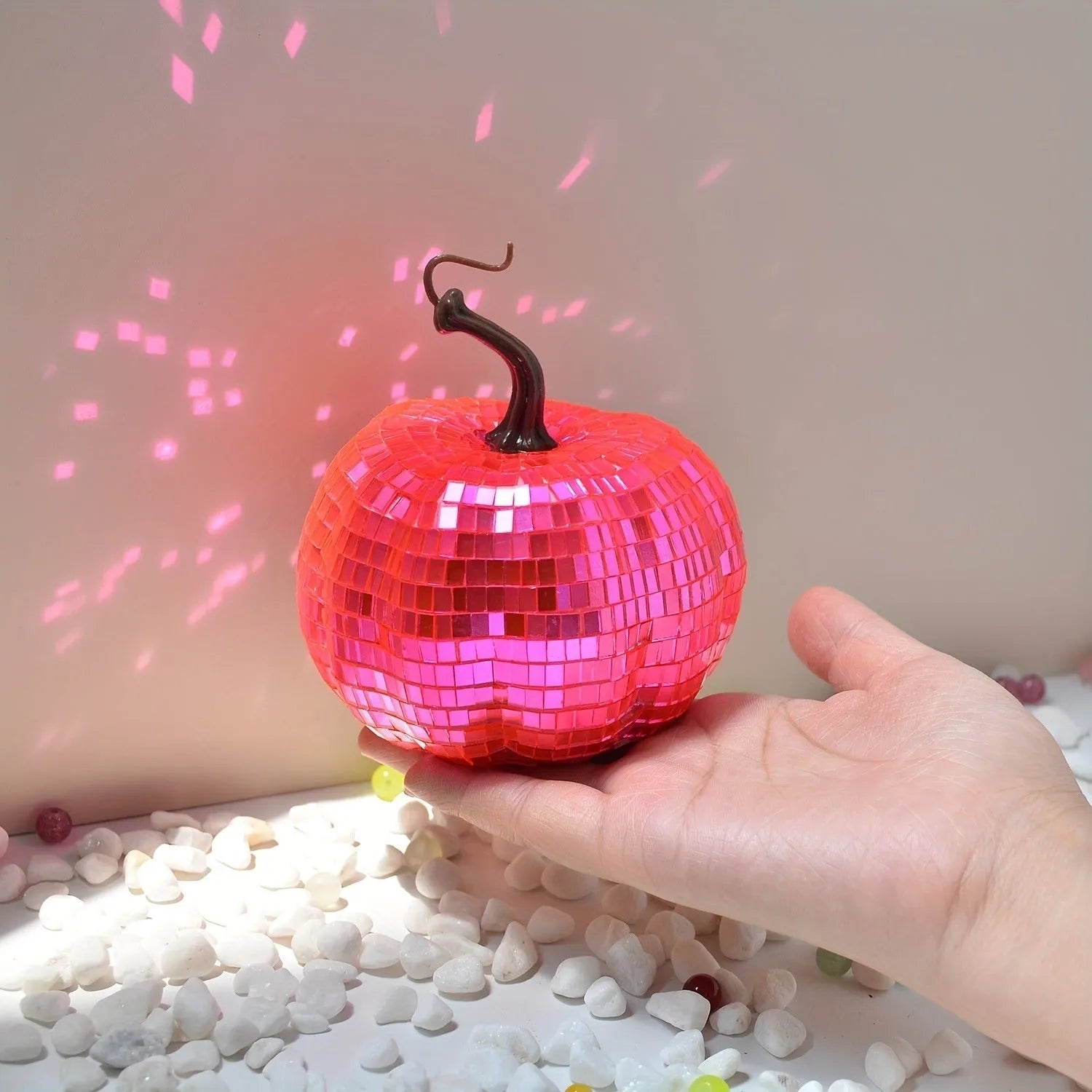 A Chinese-style embroidered glass pumpkin Halloween decoration in various sizes.