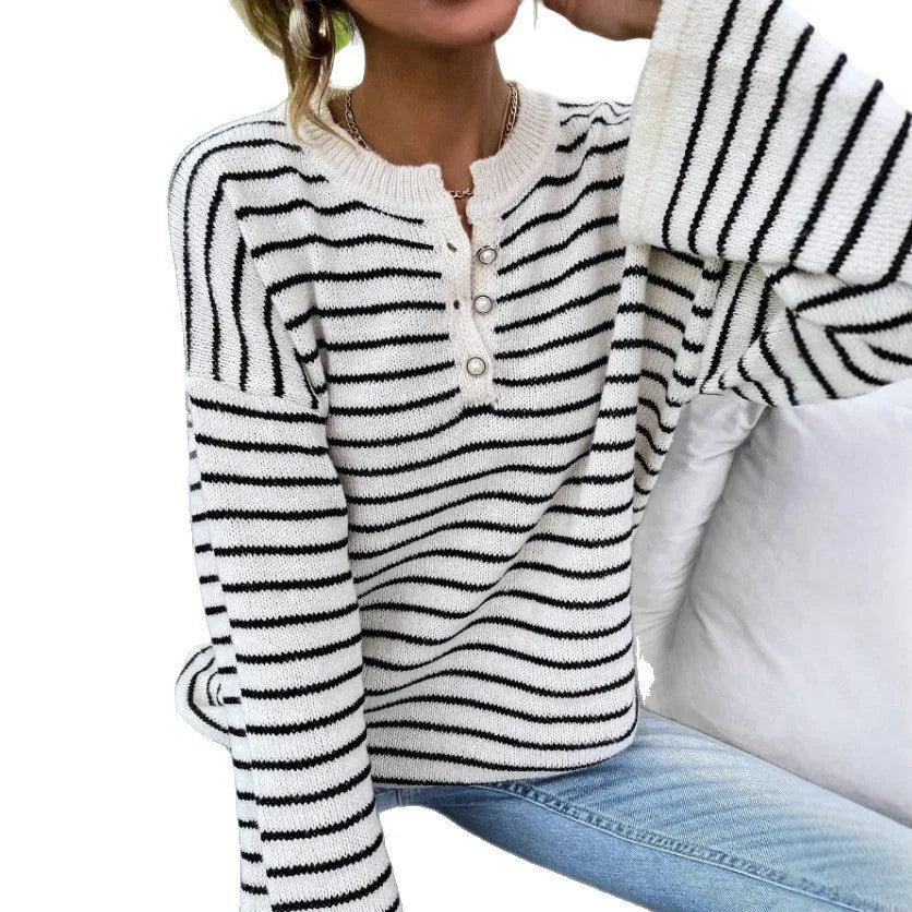 Women's black and white striped loose top with drop shoulders and button detail
