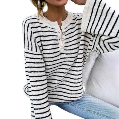 Women's black and white striped loose top with drop shoulders and button detail