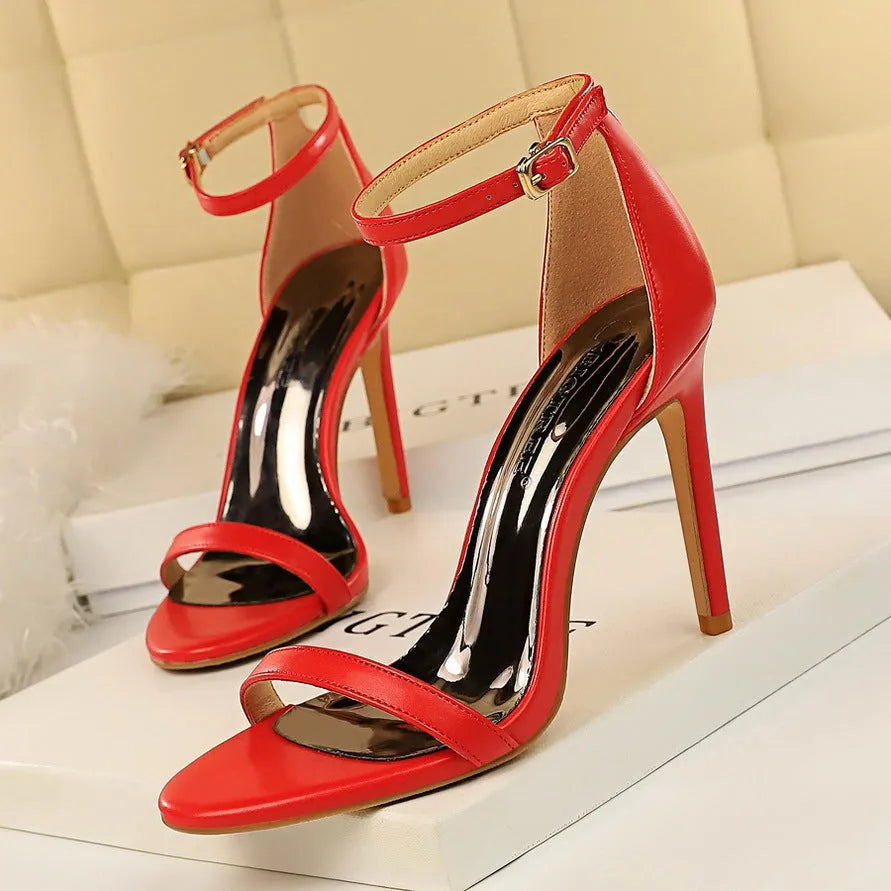 Women's open toe high heels with an ankle strap buckle in six colour options on a white background.