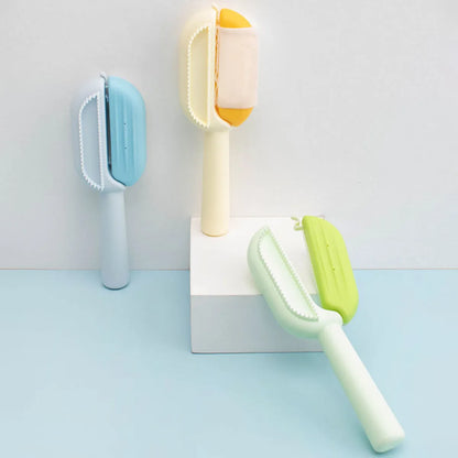 Blue pet grooming comb with integrated water tank for collecting dog and cat hair.