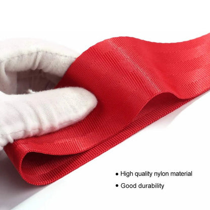 Red automotive trailer rope with bumper ribbon for vehicle towing