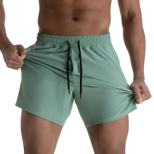 Man wearing black quick-dry polyester sports shorts suitable for running or gym workouts.
