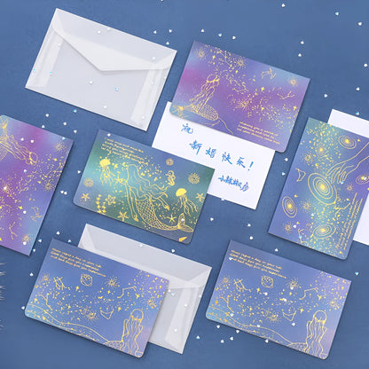 Set of three bronzing detail greeting card envelopes in cosmic colours, showing mermaid style fold.
