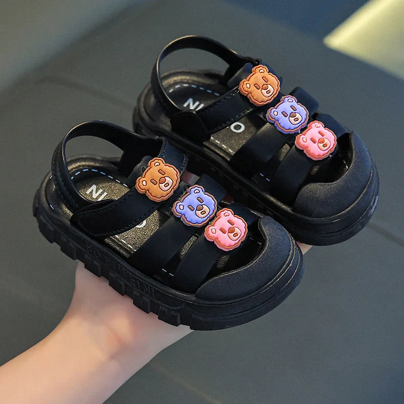 Boy's cartoon pattern baby shoes with non-slip PVC soles and Velcro fastening in black colour