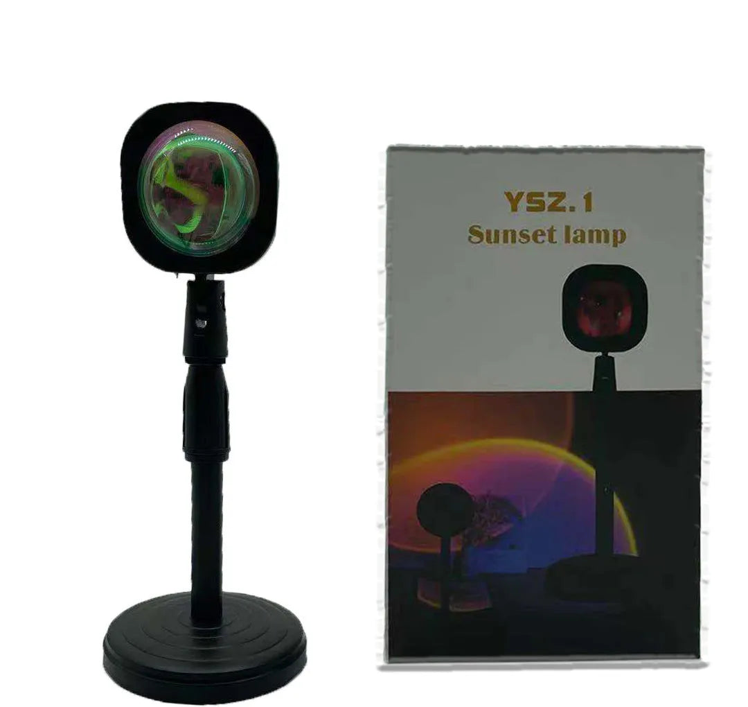 Rechargeable rainbow and sunset projection lamp with USB cable and push-button switch.
