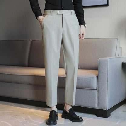 Straight-leg brown corduroy trousers with elastic waistband and slim fit design