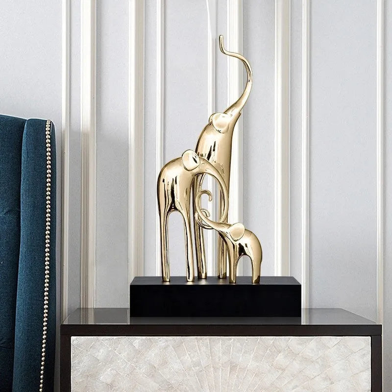Fortune Bring Elephant resin decorative figurine in gold finish, 15cm tall on a wooden surface.