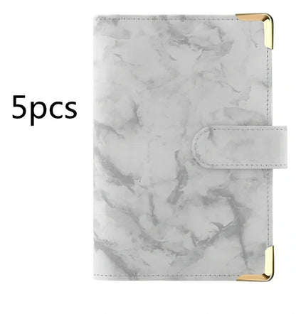 A6 leather PU binder journal open showing colour budget sheets and zip pockets with spiral binding