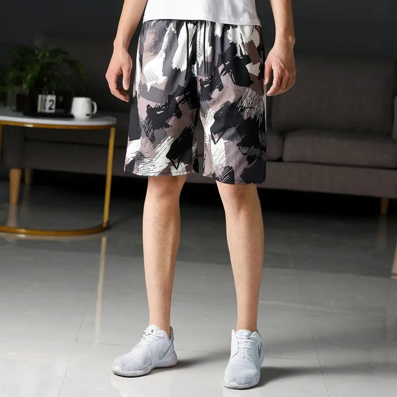 Man wearing loose-fitting striped beach pants made from quick-dry ice silk fabric.