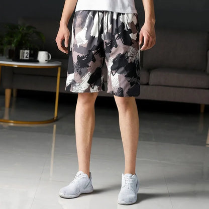 Man wearing loose-fitting striped beach pants made from quick-dry ice silk fabric.