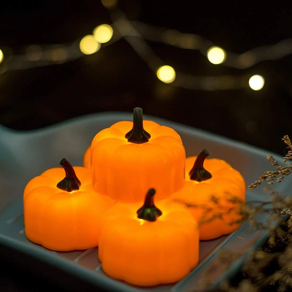 12 yellow LED pumpkin lights with electronic candle function measuring 4.9x4.3cm